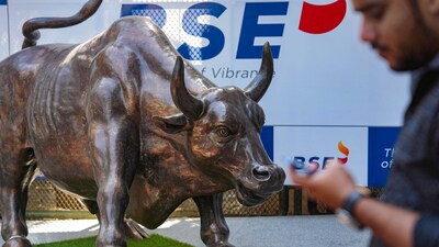 Stock market news: A man walks past the bull statue at BSE building in Mumbai. (PTI) Stock market news: A man walks past the bull statue at BSE building in Mumbai. (PTI)