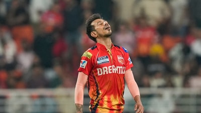 Punjab Kings followed up losing a match after scoring 245/6 by winning a game after being all out for 111 runs. They broke the record for the lowest score ever defended in a T20 match as they beat KKR by 16 runs. Yuzvendra Chahal, who has been a shadow of his usual self this season, found form in spectacular fashion, taking four wickets in his first three overs. (PTI) Punjab Kings followed up losing a match after scoring 245/6 by winning a game after being all out for 111 runs. They broke the record for the lowest score ever defended in a T20 match as they beat KKR by 16 runs. Yuzvendra Chahal, who has been a shadow of his usual self this season, found form in spectacular fashion, taking four wickets in his first three overs. (PTI)