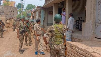 Police patrolling Samserganj villages in Murshidabad on Tuesday. (Sreyasi Pal) Police patrolling Samserganj villages in Murshidabad on Tuesday. (Sreyasi Pal)