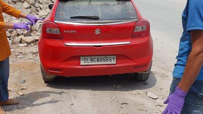 Police said the Delhi-based man’s body was found in a red Baleno car bearing registration number DL 8C AU 5661. Police said the Delhi-based man’s body was found in a red Baleno car bearing registration number DL 8C AU 5661.