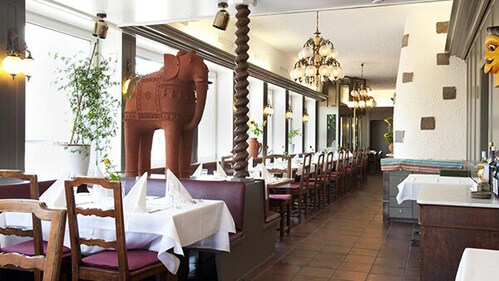 Malabar serves authentic South Indian seafood and vegetarian thalis, making it a go-to destination for spice lovers.
