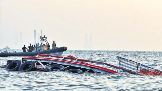 Mumbai, Dec 18 (ANI): A boat carrying 85 passengers capsizes near the Gateway of India, in Mumbai on Wednesday. Reportedly, 80 people have been rescued, 5 people are missing 5 admitted to the hospital are in critical condition and 1 is dead. (ANI Photo) (Indian Coast Guard)