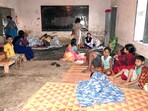 The families affected during the Murshidabad violence are seen sitting at a shelter home in Malda on Sunday.