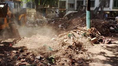 A bulldozer demolishing an allegedly illegal dargah in Nashik district of Maharashtra on Wednesday. (PTI Photo)