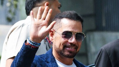 Businessman Robert Vadra greets as he reaches the Enforcement Directorate (ED) office after being summoned in connection with a Gurugram land case, in New Delhi on Tuesday. (ANI) Businessman Robert Vadra greets as he reaches the Enforcement Directorate (ED) office after being summoned in connection with a Gurugram land case, in New Delhi on Tuesday. (ANI)