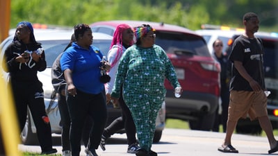 Parents were checked in to pick up their children at Wilmer-Hutchins High School, where police responded to reports of a shooting in Dallas, Tx., Tuesday, April 15, 2025. (AP Photo/Julio Cortez) (AP) Parents were checked in to pick up their children at Wilmer-Hutchins High School, where police responded to reports of a shooting in Dallas, Tx., Tuesday, April 15, 2025. (AP Photo/Julio Cortez) (AP)