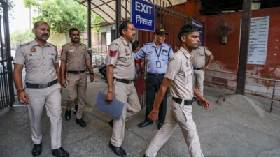 Police personnel investigate after the Dwarka court's Chief Judicial Magistrate received an email about there being a bomb planted in the court's premises, in New Delhi, Wednesday, April 16, 2025. (PTI)