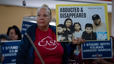 Supporters hold up signs of ‘abducted and disappeared’ as Jennifer Vasquez Sura, the wife of Kilmar Abrego Garcia of Maryland, who was mistakenly deported to El Salvador, speaks during a news conference at CASA's Multicultural Center in Hyattsville, Md., Friday, April 4, 2025. (AP Photo/Jose Luis Magana) (AP)
