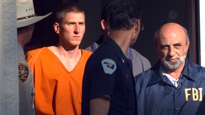 On April 21, 1995, Timothy James McVeigh is led by state and federal law enforcement officers from the Noble County Courthouse in Perry, Oklahoma. (AP Photo/John Gaps III, File) (AP)