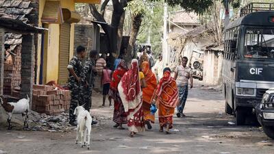 Paramilitary personnel stand guard as women in violence-affected in Murshidabad step out on Tuesday. (ANI Photo) Paramilitary personnel stand guard as women in violence-affected in Murshidabad step out on Tuesday. (ANI Photo)