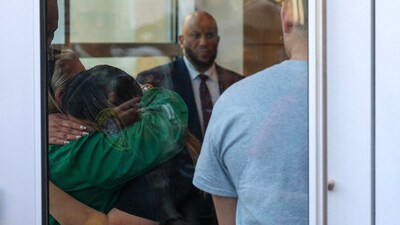 Family pastor Veronica Gonzalez, hugs Jennifer Vasquez Sura, the wife of Kilmar Abrego Garcia, who was mistakenly deported to El Salvador, before they leave Federal Court on April 15, 2025 in Greenbelt, Maryland. The Trump administration admits Abrego Garcia was deported accidentally, but has not yet acted on a judge's order to facilitate his return to the U.S. Tasos Katopodis/Getty Images/AFP (Photo by TASOS KATOPODIS / GETTY IMAGES NORTH AMERICA / Getty Images via AFP) (Getty Images via AFP)