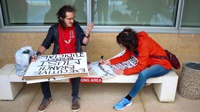 Protesters make signs to show support for Jennifer Vasquez Sura, the wife of Kilmar Abrego Garcia, who was mistakenly deported to El Salvador, at Federal Court on April 15, 2025 in Greenbelt, Maryland.&nbsp; (Getty Images via AFP)