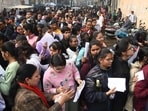 Aspirants standing in queue before appearing in the JEE Mains exam at an examination centre at Pataliputra in Patna.