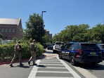 Dozens of patrol vehicles, including a forensics van, are stationed outside of Florida State University’s student union building, the scene of a shooting, Thursday, April 17, 2025, in Tallahassee, Fla. Dozens of patrol vehicles, including a forensics van, are stationed outside of Florida State University’s student union building, the scene of a shooting, Thursday, April 17, 2025, in Tallahassee, Fla.