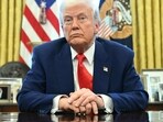 US President Donald Trump looks on after signing an executive order in the Oval Office of the White House. US President Donald Trump looks on after signing an executive order in the Oval Office of the White House.