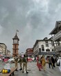 Police personnel stand guard near the Ghanta Ghar on a cloudy day, in Srinagar, on Wednesday. (PTI) Police personnel stand guard near the Ghanta Ghar on a cloudy day, in Srinagar, on Wednesday. (PTI)