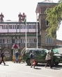 Security personnel outside the Himachal Pradesh secretariat after it received a bomb threat via email in Shimla on Thursday. (PTI) Security personnel outside the Himachal Pradesh secretariat after it received a bomb threat via email in Shimla on Thursday. (PTI)