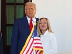 President Donald Trump, center, greets Italy's Prime Minister Giorgia Meloni, right, upon her arrival at the White House, Thursday, April 17, 2025, in Washington. (AP Photo/Tom Brenner)