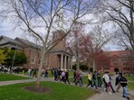 Students walk on the campus of Harvard University in Cambridge, Massachusetts, U.S., April 15, 2025.   