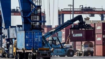 A crane loads shipping containers on a truck at the Deendayal Port Authority (DPA) in Kandla in Gujarat on April 5 (AFP FILE PHOTO) A crane loads shipping containers on a truck at the Deendayal Port Authority (DPA) in Kandla in Gujarat on April 5 (AFP FILE PHOTO)