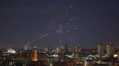 A flying Russian drone, tracers and searchlights are seen in the night sky as Ukrainian servicemen search for drones and fire at them during a Russian drone strike, amid Russia's attack on Ukraine, in Kyiv, on April 12 (REUTERS) A flying Russian drone, tracers and searchlights are seen in the night sky as Ukrainian servicemen search for drones and fire at them during a Russian drone strike, amid Russia's attack on Ukraine, in Kyiv, on April 12 (REUTERS)