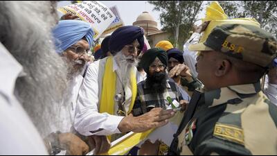 BSF personnel stop Shiromani Akali Dal (Amritsar) president Simranjit Singh Mann and his supporters during a protest march demanding opening of borders for trade between India and Pakistan, at Attari border, on Thursday. (PTI) BSF personnel stop Shiromani Akali Dal (Amritsar) president Simranjit Singh Mann and his supporters during a protest march demanding opening of borders for trade between India and Pakistan, at Attari border, on Thursday. (PTI)