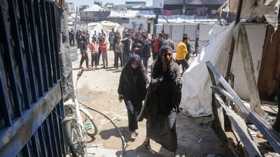 Palestinians inspect the damage after an Israeli strike on a school housing displaced Palestinians in Jabalia in the northern Gaza Strip on April 17, 2025. (AFP) Palestinians inspect the damage after an Israeli strike on a school housing displaced Palestinians in Jabalia in the northern Gaza Strip on April 17, 2025. (AFP)