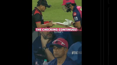 Rahul Dravid looks on as umpires check Riyan Parag's bat Rahul Dravid looks on as umpires check Riyan Parag's bat