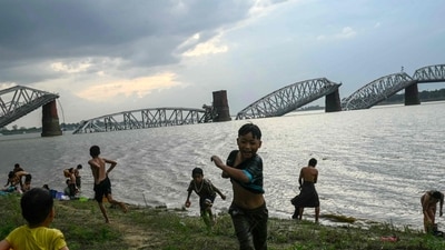 People gathered on the banks of the Irrawaddy River in front of the collapsed Ava Bridge, also known as the Inwa Bridge, in Mandalay after an earthquake struck central Myanmar. (Photo by Sai Aung MAIN / AFP) People gathered on the banks of the Irrawaddy River in front of the collapsed Ava Bridge, also known as the Inwa Bridge, in Mandalay after an earthquake struck central Myanmar. (Photo by Sai Aung MAIN / AFP)