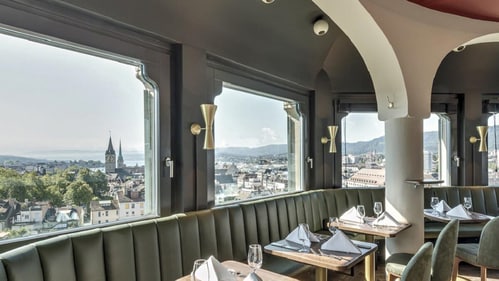 Jules Verne Panorama Bar offers breathtaking rooftop views of Zurich, paired with exquisite cocktails and French-inspired cuisine.