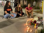 People sit in front of a makeshift memorial outside the student union at Florida State University, Thursday, April 17, 2025, in Tallahassee. People sit in front of a makeshift memorial outside the student union at Florida State University, Thursday, April 17, 2025, in Tallahassee.