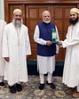 Prime Minister Narendra Modi being felicitated by a delegation from the Dawoodi Bohra community, in New Delhi on Thursday. (ANI PHOTO)