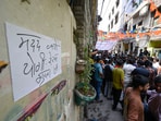 A crowd gathered outside the house of a 17-year-old boy who was stabbed to death in the Seelampur area in New Delhi, India, on Friday, April 18, 2025. 