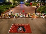 Students hold a vigil near the scene of a shooting near the Florida State University student center on April 17, 2025 in Tallahassee, Florida. Students hold a vigil near the scene of a shooting near the Florida State University student center on April 17, 2025 in Tallahassee, Florida.