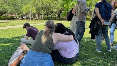 The suspect, Phoenix Ikner, is believed to have used his mother’s former service firearm during the attack. He had previously been expelled from a political club for promoting white nationalist ideas.In pic: People comfort each other on the campus of Florida State University in Tallahassee. (AP) The suspect, Phoenix Ikner, is believed to have used his mother’s former service firearm during the attack. He had previously been expelled from a political club for promoting white nationalist ideas.In pic: People comfort each other on the campus of Florida State University in Tallahassee. (AP)