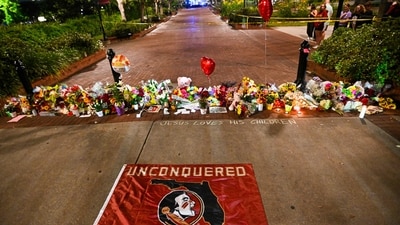 Students hold a vigil near the scene of a shooting near the Florida State University student center on April 17, 2025 in Tallahassee, Florida. (Getty Images via AFP) Students hold a vigil near the scene of a shooting near the Florida State University student center on April 17, 2025 in Tallahassee, Florida. (Getty Images via AFP)