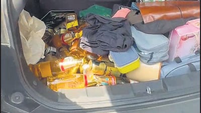 The boot of the accused’s car filled with bottles of beer. (HT Photo)