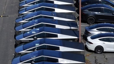 In an aerial view, brand new Tesla Cybertrucks sit parked in a lot at a Tesla dealership on April 02, 2025 in Corte Madera, California. (Justin Sullivan/Getty Images via AFP) In an aerial view, brand new Tesla Cybertrucks sit parked in a lot at a Tesla dealership on April 02, 2025 in Corte Madera, California. (Justin Sullivan/Getty Images via AFP)