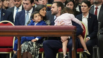 The Vance family arrived at St. Peter's Basilica just moments before the 5 p.m. start of the Good Friday liturgy, accompanied by more than a dozen Secret Service members. (AP Photo/Alessandra Tarantino) (AP) The Vance family arrived at St. Peter's Basilica just moments before the 5 p.m. start of the Good Friday liturgy, accompanied by more than a dozen Secret Service members. (AP Photo/Alessandra Tarantino) (AP)