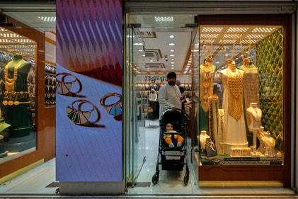 People shop for gold at a jewelry shop at a gold market in Dubai, United Arab Emirates, Wednesday, April 9, 2025. (AP Photo/Altaf Qadri) (AP) People shop for gold at a jewelry shop at a gold market in Dubai, United Arab Emirates, Wednesday, April 9, 2025. (AP Photo/Altaf Qadri) (AP)