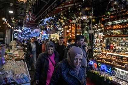 Shoppers walk through the spice bazaar in the Eminonu district of Istanbul on April 1, 2025. (Photo by Ed JONES / AFP) (AFP) Shoppers walk through the spice bazaar in the Eminonu district of Istanbul on April 1, 2025. (Photo by Ed JONES / AFP) (AFP)