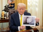 Trump appeared to show a digitally altered photo of Kilmar Abrego Garcia's tattoos