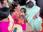 National Commission for Women (NCW) Chairperson Vijaya Rahatkar meets the families affected by the Murshidabad violence at a shelter home in Malda on Friday. 