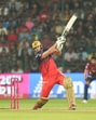 RCB's Tim David plays a shot against PBKS. (PTI) RCB's Tim David plays a shot against PBKS. (PTI)