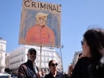 A protestor holds a draw depicting US President Donal Trump bearing the writing 'Criminal' during an anti-Trump protest called by Democrats Abroad organisation in Madrid's Puerta del Sol on March 29, 2025. A protestor holds a draw depicting US President Donal Trump bearing the writing 'Criminal' during an anti-Trump protest called by Democrats Abroad organisation in Madrid's Puerta del Sol on March 29, 2025.