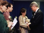 Aren Almon greets President Bill Clinton after a prayer service for the victims of the deadly truck bomb attack in Oklahoma City on April 23, 1995.