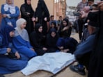 Palestinians mourn over the body of Kinan Edwan, 2 years old, killed in an Israeli army airstrike, during his funeral in Khan Younis, southern Gaza Strip, Saturday, April 19, 2025.