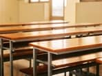 The purported video shows the teacher offering a drink to young boys in cups in a room. The purported video shows the teacher offering a drink to young boys in cups in a room.
