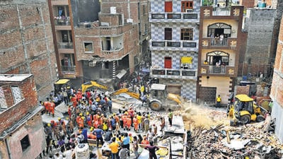 Emergency responders carry out search and rescue operations at the site in Mustafabad, Delhi, on Saturday. (Sanchit Khanna/HT Photo) Emergency responders carry out search and rescue operations at the site in Mustafabad, Delhi, on Saturday. (Sanchit Khanna/HT Photo)
