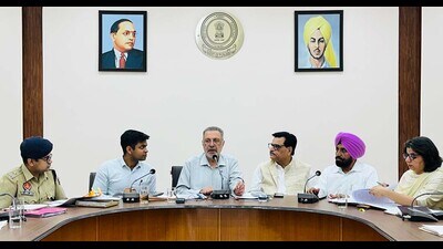 Health minister Dr Balbir Singh (centre) during a meeting with officials in Ludhiana on Saturday. (HT Photo) Health minister Dr Balbir Singh (centre) during a meeting with officials in Ludhiana on Saturday. (HT Photo)